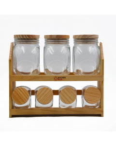 A set of spices cans with a wooden stand