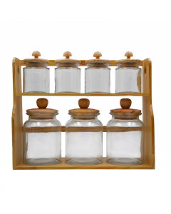 A set of spices cans with a wooden stand