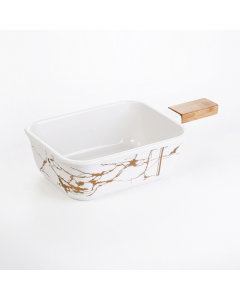 Porcelain serving plate is a wooden hand