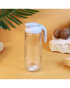 Glass jake with a gray lid